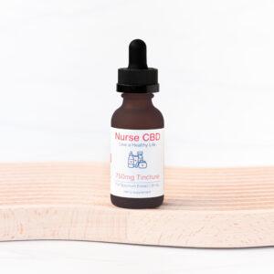 A CBD tincture bottle labeled "Nurse CBD - Live a Healthy Life, 750mg Tincture" standing on a light wooden surface against a white background.