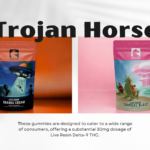 Two packs of Trojan Horse gummies, one Orange Cream and one Tropical Blast,